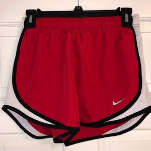 Red Nike shorts